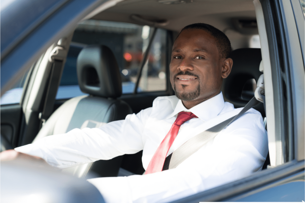 man driving his company car