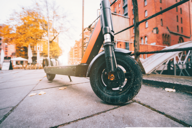 e-scooter parked on pavement