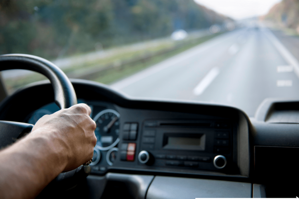 a driver holding a car steering