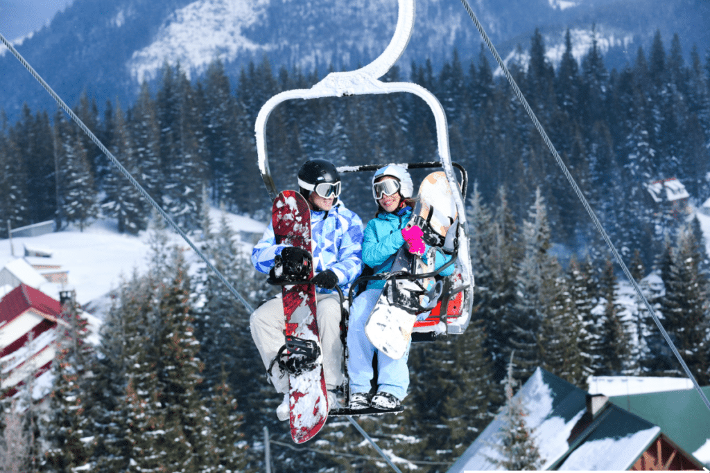 couples riding ski lift at the resort