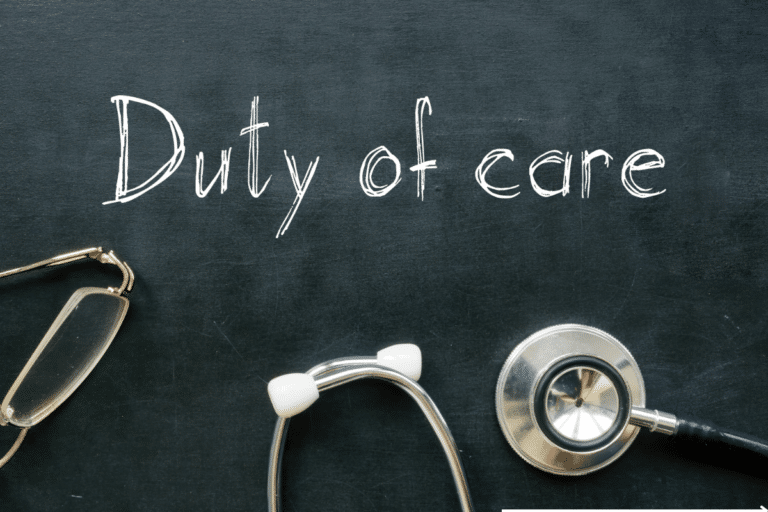 "duty of care" written on a board and stethoscope