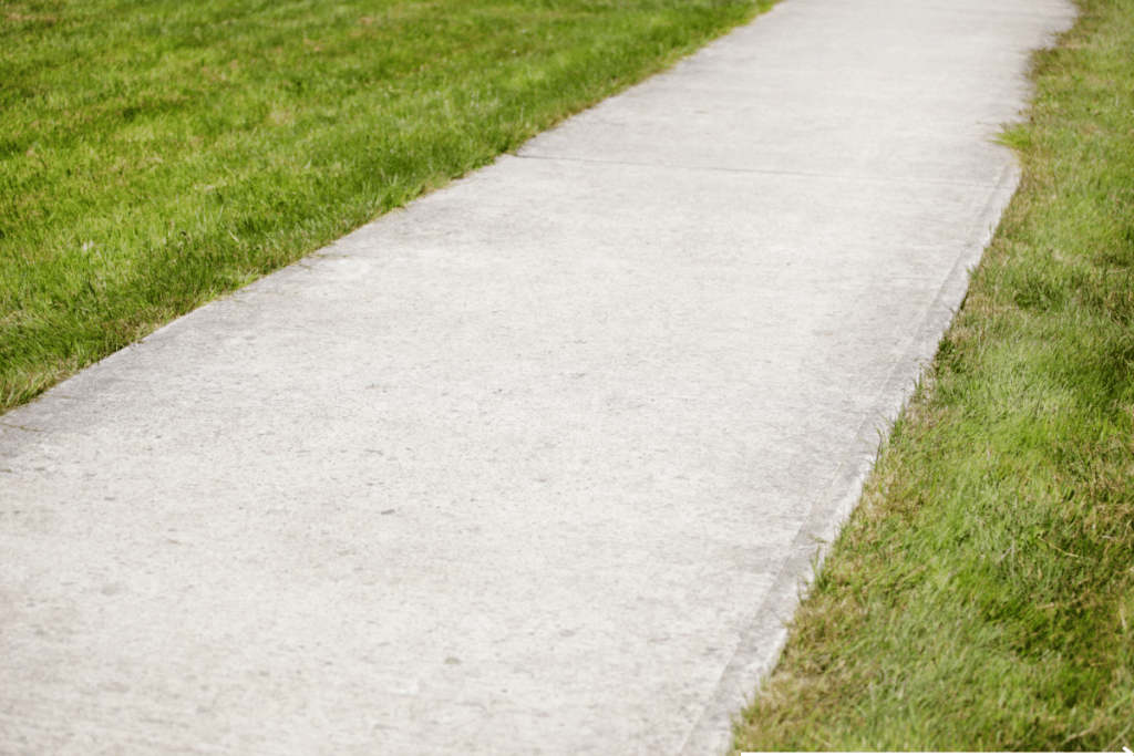 clean sidewalk with beautiful grass on the side