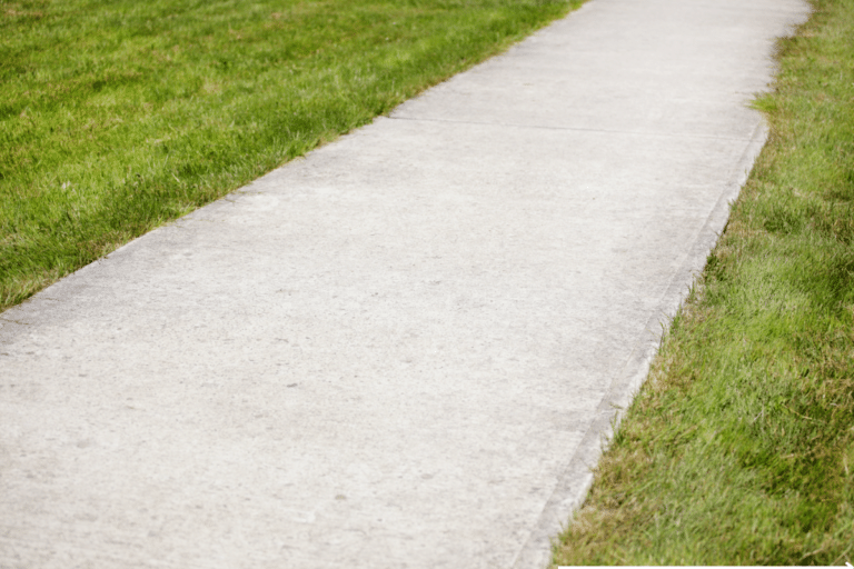 clean sidewalk with beautiful grass on the side