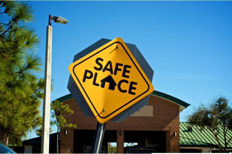 a mini shelter with a safe place sign post