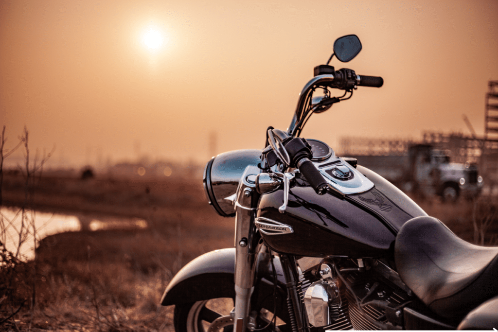 motorcycle parked at sunset