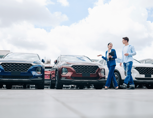 A sales rep selling cars to a customer