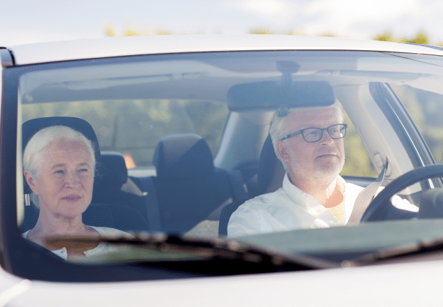 Old couple inside a car.