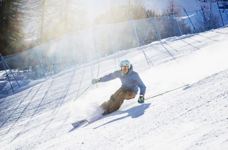 Woman skiing down slope